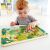 Child playing with HAPE Jungle Maze magnetic toy