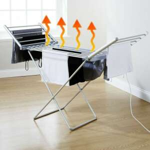 Elektromos ruhaszárító ruhákkal rajta, a fűtőelem látható - Ruhaszárító