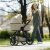 Petite & Mars ICON 2-in-1 Stroller in Mocha Beige with parent, lifestyle shot
