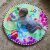 Baby playing on tummy time with Baby Einstein water mat