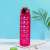Magenta motivational water bottle with time scale and quotes, 1 liter, on a blue background