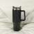 Black 1200ml stainless steel travel mug with handle and lid, on a white surface