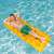 Man relaxing on Bestway inflatable lounger with 18 pockets, orange, in swimming pool