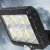 Close-up of solar powered motion sensor LED floodlight with 120 COB LEDs, 30W, 5m cable, IP65 waterproof