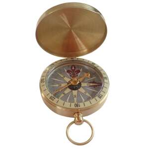 Classic brass compass with a compass needle, compass rose, and degree markings - Navigation compass