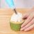 Decorating a cupcake with Timeless Tools piping bag and nozzle