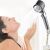 Woman enjoying high-pressure shower head