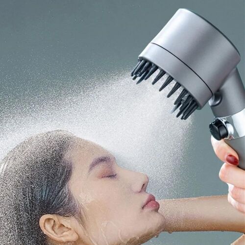 Woman using high-pressure shower head for hair massage