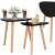 Springos nesting coffee table set, black triangle top with wooden legs, two sizes, modern design, styled with drinks and flowers