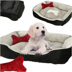 Dog using black and white dog bed with bone and bow details - Pet Care