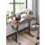 SONGMICS electric standing desk, rustic brown, in home office setting
