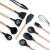 Black silicone kitchen tools with wooden handles