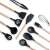 Black silicone kitchen tools with wooden handles