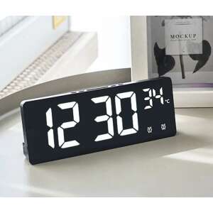 Black digital alarm clock with white LED display showing 12:30 and 24 degrees Celsius, on a white table - OEM Alarm Clock
