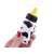 Hand holding a black and white cow print stress relief bottle, squeeze toy, fidget toy