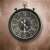 Koopman Design 60cm Pocket Watch Wall Clock, black with roman numerals and gears, hanging on a wall