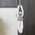 Plush Sifaka lemur toy hanging from a cabinet handle