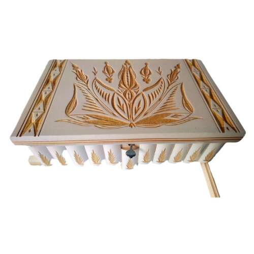 Top view of the wooden secret box with intricate carvings and a keyhole