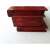 Side view of red wooden secret box with intricate carvings