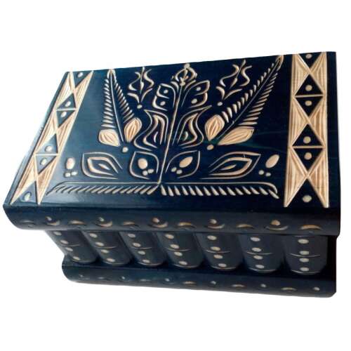 Blue wooden puzzle box with white floral carvings, closed