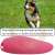 Pink ultrasonic dog training device with a dog running in the background