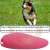 Pink ultrasonic dog training device with a dog running in the background