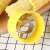 Yellow corn cob peeler, close-up of the stainless steel blades