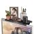 Korbi Foldable Monitor Shelf with picture frame, plant, glasses, and pens on top of a monitor