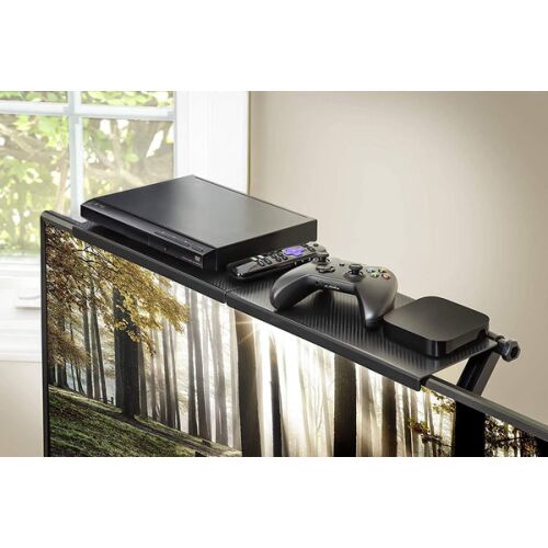 Korbi Foldable Monitor Shelf with DVD player, remote, game controller, and streaming box on top of a TV