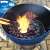 Marabu charcoal burning in a blue kettle grill