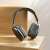 MRG MP9 Plus On Ear Bluetooth Headphones, Black, on wooden surface