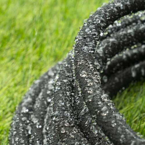 Black 10m soaker hose with quick connectors, ideal for watering plants and gardens