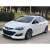 Opel Astra J 2009-2020 mit Aftermarket-Felgen und Seitenschwellern