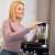 Woman using the blender attachment of the Ruhhy 3-in-1 stand mixer