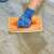 Handy float trowel with sponge, orange, 280 x 140 mm, in use