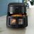 Philips NA230/00 air fryer with cooked chicken inside