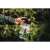 Person using Fiskars 1.8L Pressure Sprayer to water plants in the garden