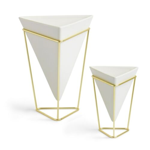 Umbra Trigg set of two white ceramic planters with gold wire frames.