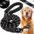 Black and white rope dog leash with padded handle, dog in the background