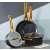 Ambition Royal cookware set with gold handles, including a pot with lid, frying pan and saucepan