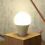 Ledvance Smart+ WiFi A75 smart bulb emitting warm light