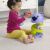 Toddler playing with Fisher-Price Purr-fect Ball Tower toy