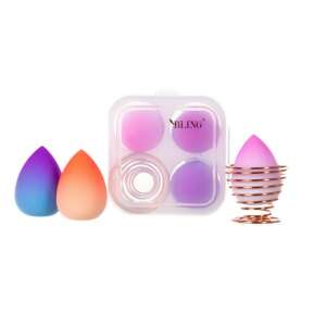 BLING Beauty Blender Box Ombre Make-up Schwamm Set mit 3 Stück und Ständer - 3 Make-up Schwämme in einem Set mit einem Ständer, um Ihren Schminktisch zu dekorieren und zu färben! Das Set ist in einer praktischen Box verpackt. Der praktische Ständer ermöglicht eine bequeme Aufbewahrung und Trocknung des Beauty Blenders. Der Ständer ist aus roségoldfarbenem Metall gefertigt. Mit dem BLING Schwamm wird Ihr tägliches Make-up einfacher! Die besondere Form unseres Schwamms ermöglicht es Ihnen, Foundation in jede Pore Ihrer Haut aufzutragen. Das spitze Ende ist perfekt zum Auftragen von Concealer um die Augen und die Nase. Mit der abgeschnittenen Spitze können Sie schnell Foundation auf das gesamte Gesicht auftragen. BLING Schwämme sind extrem weich und haben die richtige Porosität, so dass Kosmetika makellos auf dem Gesicht aussehen. Sie sind angenehm zu bearbeiten, beeindrucken mit ihrem außergewöhnlichen Aussehen und ihren Farben. Probieren Sie es jetzt aus und bringen Sie Ihr Make-up auf die nächste Stufe! - Make-Up Schwämme