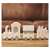 White wooden Christmas train with Santa Claus, a house and a carriage, with warm white LED lights, on a wooden table
