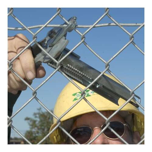 A person using fence wire pliers to install a chain link fence