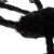 Close-up of the black hairy spider Halloween decoration with red eyes