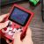 Retro Mini Game Console playing Super Mario