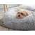 Grey plush dog bed with a small dog lying in it