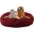 Red plush dog bed with a cat and a dog laying in it