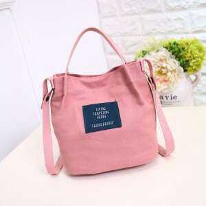 Pink canvas shoulder bag with 'Living Traveling Share' logo - Handbag